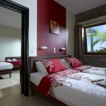 Family room with twin beds at Country Hotel Velani in Greece