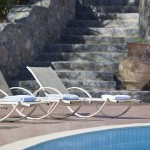 Infinity swimming pool with a spacious sun deck at Country Hotel Velani in Greece, Crete.